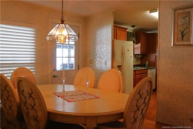Delightful furnished home featuring wood laminate flooring on Indianwood Golf and Country Club in Florida - for sale on GolfHomes.com, golf home, golf lot