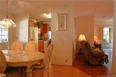 Delightful furnished home featuring wood laminate flooring on Indianwood Golf and Country Club in Florida - for sale on GolfHomes.com, golf home, golf lot