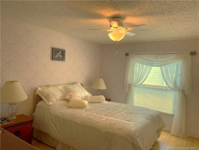 Delightful furnished home featuring wood laminate flooring on Indianwood Golf and Country Club in Florida - for sale on GolfHomes.com, golf home, golf lot