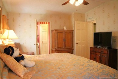 Delightful furnished home featuring wood laminate flooring on Indianwood Golf and Country Club in Florida - for sale on GolfHomes.com, golf home, golf lot