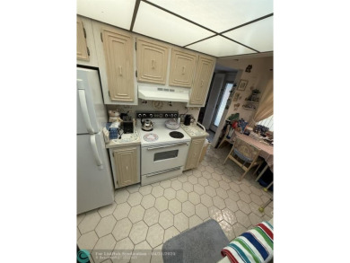 2 bedroom 2 bath condo with lake and golf course view from your on Colony West Country Club in Florida - for sale on GolfHomes.com, golf home, golf lot