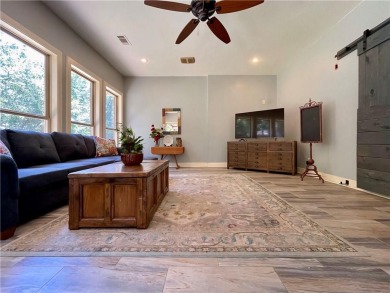 Live in comfort and style on the 16th tee at Lions Den Golf on Lions Den Golf Club in Arkansas - for sale on GolfHomes.com, golf home, golf lot