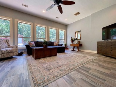 Live in comfort and style on the 16th tee at Lions Den Golf on Lions Den Golf Club in Arkansas - for sale on GolfHomes.com, golf home, golf lot