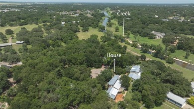 Tucked within a serene, tree-lined cul-de-sac, this timeless New on Mill Creek Golf Club in Texas - for sale on GolfHomes.com, golf home, golf lot