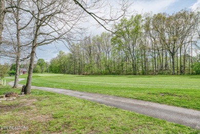 Discover comfort, style, and scenic golf-front views in this on Deer Creek Golf Club in Tennessee - for sale on GolfHomes.com, golf home, golf lot