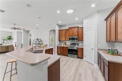 Welcome to this lovingly maintained home, located in the gated on Heritage Isles Golf and Country Club in Florida - for sale on GolfHomes.com, golf home, golf lot