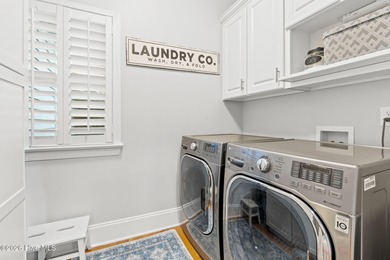 Elegant Charleston-style custom home located in an amenity-rich on Lockwood Folly Country Club in North Carolina - for sale on GolfHomes.com, golf home, golf lot