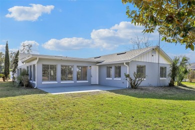 One or more photo(s) has been virtually staged. Nestled in a on Palm Harbor Golf Club in Florida - for sale on GolfHomes.com, golf home, golf lot