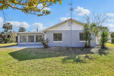 One or more photo(s) has been virtually staged. Nestled in a on Palm Harbor Golf Club in Florida - for sale on GolfHomes.com, golf home, golf lot