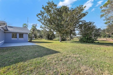 One or more photo(s) has been virtually staged. Nestled in a on Palm Harbor Golf Club in Florida - for sale on GolfHomes.com, golf home, golf lot