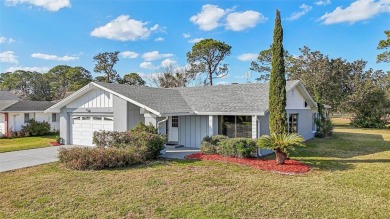 One or more photo(s) has been virtually staged. Nestled in a on Palm Harbor Golf Club in Florida - for sale on GolfHomes.com, golf home, golf lot