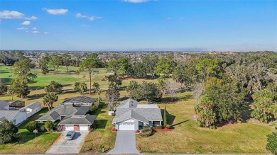 One or more photo(s) has been virtually staged. Nestled in a on Palm Harbor Golf Club in Florida - for sale on GolfHomes.com, golf home, golf lot