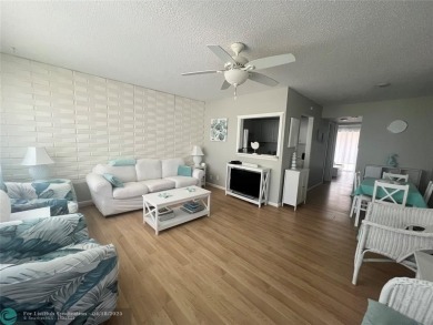 CUTE AS A BUTTON! CHARMING SECOND FLOOR 1 BEDROOM, 1 BATH CONDO on Hillsboro Pines Golf in Florida - for sale on GolfHomes.com, golf home, golf lot