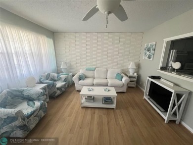 CUTE AS A BUTTON! CHARMING SECOND FLOOR 1 BEDROOM, 1 BATH CONDO on Hillsboro Pines Golf in Florida - for sale on GolfHomes.com, golf home, golf lot