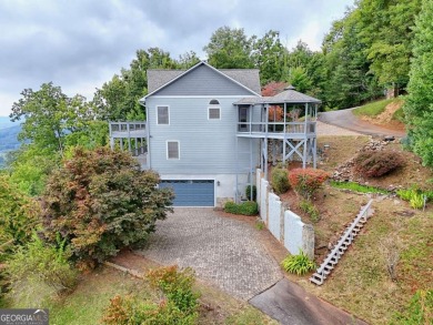 Breathtaking views abound from this 3-bedroom, 3.5-bath home on on Chatuge Shores Golf Course in North Carolina - for sale on GolfHomes.com, golf home, golf lot