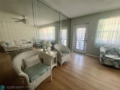 CUTE AS A BUTTON! CHARMING SECOND FLOOR 1 BEDROOM, 1 BATH CONDO on Hillsboro Pines Golf in Florida - for sale on GolfHomes.com, golf home, golf lot