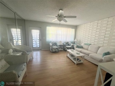 CUTE AS A BUTTON! CHARMING SECOND FLOOR 1 BEDROOM, 1 BATH CONDO on Hillsboro Pines Golf in Florida - for sale on GolfHomes.com, golf home, golf lot