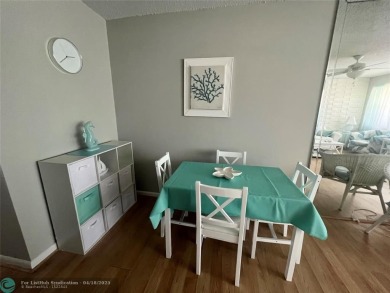 CUTE AS A BUTTON! CHARMING SECOND FLOOR 1 BEDROOM, 1 BATH CONDO on Hillsboro Pines Golf in Florida - for sale on GolfHomes.com, golf home, golf lot