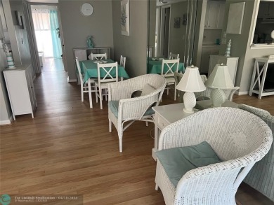 CUTE AS A BUTTON! CHARMING SECOND FLOOR 1 BEDROOM, 1 BATH CONDO on Hillsboro Pines Golf in Florida - for sale on GolfHomes.com, golf home, golf lot