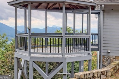 Breathtaking views abound from this 3-bedroom, 3.5-bath home on on Chatuge Shores Golf Course in North Carolina - for sale on GolfHomes.com, golf home, golf lot