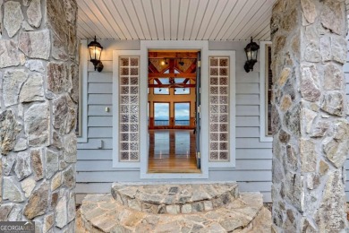 Breathtaking views abound from this 3-bedroom, 3.5-bath home on on Chatuge Shores Golf Course in North Carolina - for sale on GolfHomes.com, golf home, golf lot