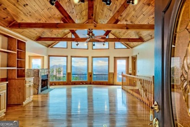 Breathtaking views abound from this 3-bedroom, 3.5-bath home on on Chatuge Shores Golf Course in North Carolina - for sale on GolfHomes.com, golf home, golf lot