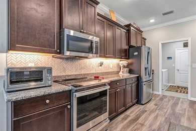 Welcome to a life that feels like vacation every day. Nestled in on Arlington Ridge Golf Club in Florida - for sale on GolfHomes.com, golf home, golf lot