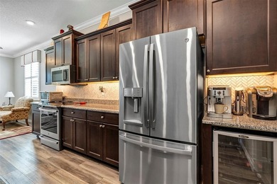 Welcome to a life that feels like vacation every day. Nestled in on Arlington Ridge Golf Club in Florida - for sale on GolfHomes.com, golf home, golf lot