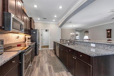 Welcome to a life that feels like vacation every day. Nestled in on Arlington Ridge Golf Club in Florida - for sale on GolfHomes.com, golf home, golf lot