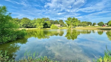 Nestled on a peaceful lot that backs to a well-stocked fishing on Links At Lands End in Texas - for sale on GolfHomes.com, golf home, golf lot
