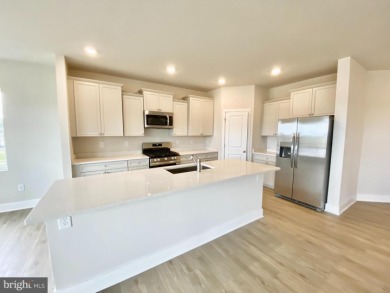 MOVE IN READY-UNFINISHED BASEMENT!  Photos are of actual home! on Plantation Lakes Golf and Country Club in Delaware - for sale on GolfHomes.com, golf home, golf lot