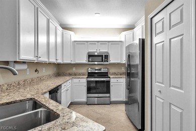 Welcome to this charming villa, formerly a model home, that is on Pelican Preserve Golf Club in Florida - for sale on GolfHomes.com, golf home, golf lot