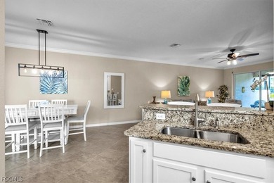 Welcome to this charming villa, formerly a model home, that is on Pelican Preserve Golf Club in Florida - for sale on GolfHomes.com, golf home, golf lot