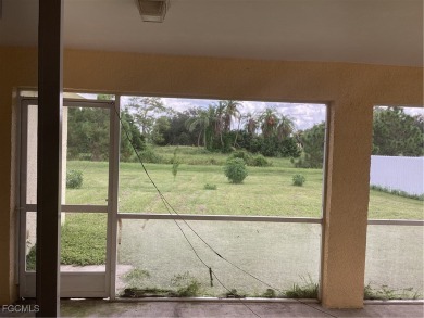 Backyard views like this are rare in Lehigh Acres. Located in a on Mirror Lakes Golf Club in Florida - for sale on GolfHomes.com, golf home, golf lot