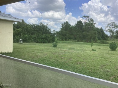 Backyard views like this are rare in Lehigh Acres. Located in a on Mirror Lakes Golf Club in Florida - for sale on GolfHomes.com, golf home, golf lot