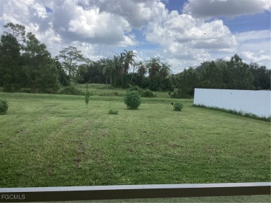 Backyard views like this are rare in Lehigh Acres. Located in a on Mirror Lakes Golf Club in Florida - for sale on GolfHomes.com, golf home, golf lot