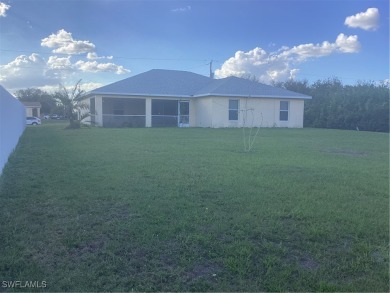 Backyard views like this are rare in Lehigh Acres. Located in a on Mirror Lakes Golf Club in Florida - for sale on GolfHomes.com, golf home, golf lot