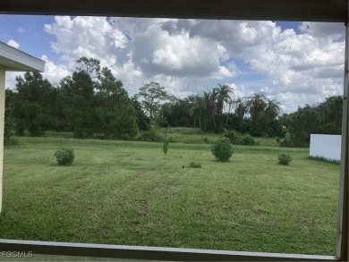 Backyard views like this are rare in Lehigh Acres. Located in a on Mirror Lakes Golf Club in Florida - for sale on GolfHomes.com, golf home, golf lot