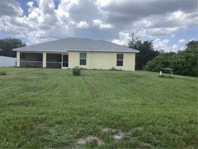 Backyard views like this are rare in Lehigh Acres. Located in a on Mirror Lakes Golf Club in Florida - for sale on GolfHomes.com, golf home, golf lot