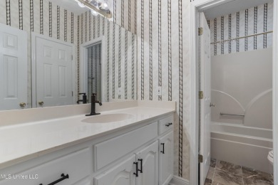 Beautiful 4-bedroom 2-bath brick home nestled in one of on Mississippi National Golf Course in Mississippi - for sale on GolfHomes.com, golf home, golf lot