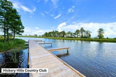 Love to golf? This beautiful 4-bedroom 2-bath brick home nestled on Mississippi National Golf Course in Mississippi - for sale on GolfHomes.com, golf home, golf lot