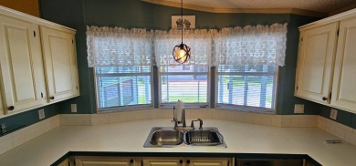 Furnished, spacious 2 bedroom 2 bath home in 55 + Resort style on Zephyrhills Municipal Golf Course in Florida - for sale on GolfHomes.com, golf home, golf lot
