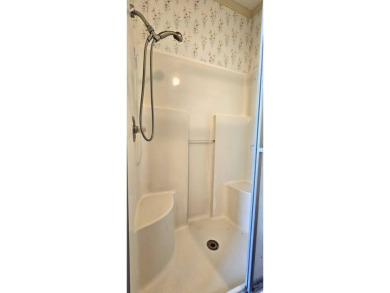 Furnished, spacious 2 bedroom 2 bath home in 55 + Resort style on Zephyrhills Municipal Golf Course in Florida - for sale on GolfHomes.com, golf home, golf lot