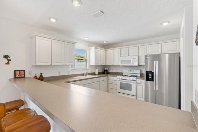 Bond Paid - This conviently located turn-key courtyard villa at on The Links of Spruce Creek in Florida - for sale on GolfHomes.com, golf home, golf lot