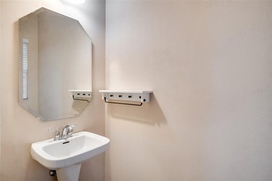 This Eagle Creek townhouse with an upstairs balcony overlooking on Eagle Creek Golf Club in Florida - for sale on GolfHomes.com, golf home, golf lot