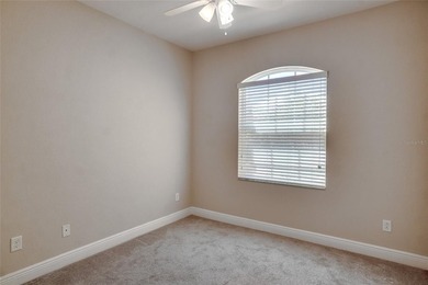 This Eagle Creek townhouse with an upstairs balcony overlooking on Eagle Creek Golf Club in Florida - for sale on GolfHomes.com, golf home, golf lot