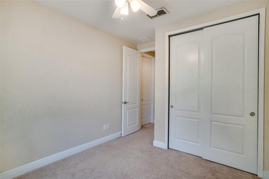 This Eagle Creek townhouse with an upstairs balcony overlooking on Eagle Creek Golf Club in Florida - for sale on GolfHomes.com, golf home, golf lot