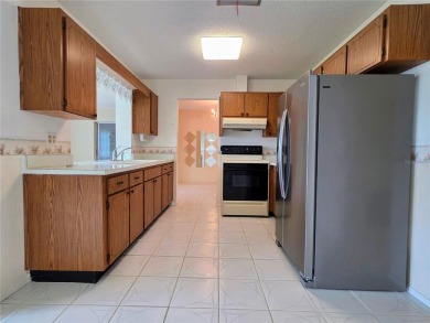 Welcome to this amazing 2-bedroom, 2-bath home, perfectly on Mainlands Golf Club in Florida - for sale on GolfHomes.com, golf home, golf lot