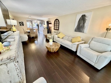 WELCOME to easy FLORIDA living in this uniquely enhanced 2/2 on Wynmoor Golf Course in Florida - for sale on GolfHomes.com, golf home, golf lot