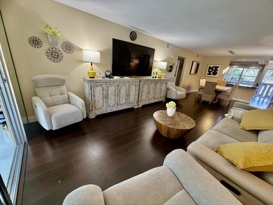 WELCOME to easy FLORIDA living in this uniquely enhanced 2/2 on Wynmoor Golf Course in Florida - for sale on GolfHomes.com, golf home, golf lot